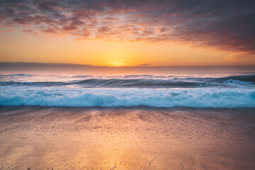 Naklejka na ściany i meble Sunset on the beach in Big Sur, California
