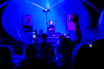 Fototapeta na wymiar Male DJ mixing music in nightclub