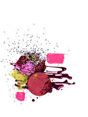 Still life of makeup products isolated on a white background. Abstract composition of smudged and scattered makeup texture. Closeup of colourful beauty products for makeup artists or design element.
