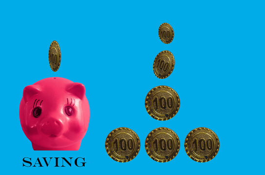 Top view, Pink piggy bank and coins isolated on cyan background for stock photo. Financial and banking concept. Saving money for finance and investment.