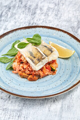 white fish with rice and vegetables