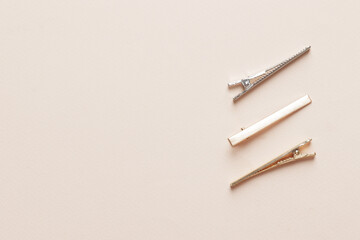 Fashionable, stylish colored hair clips on a colored background