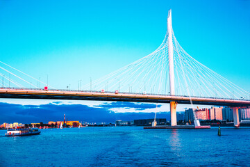 Cable-stayed bridge Western high-speed diameter across Peter's fairway in St. Petersburg at sunset,...