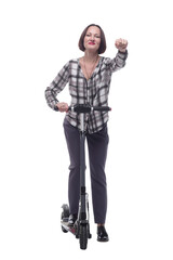 confident mature woman with electric scooter showing thumbs up.