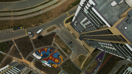 Modern urban architecture. Multi-storey buildings with infrastructure. Densely populated urban area. Overcast weather. Aerial photography.