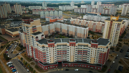 Fototapeta premium Modern urban architecture. Multi-storey buildings with infrastructure. Densely populated urban area. Overcast weather. Aerial photography.