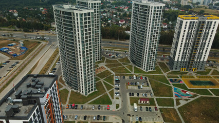 Fototapeta premium Construction site of a new city block. Construction of multi-storey buildings. Overcast weather. Aerial photography.