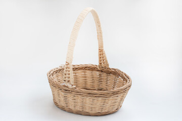 empty wicker basket made of vines on a white background. Easter Item