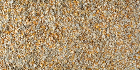 chicken scratch, chicken feed consists of cracked corn with other grains which is a great source of energy for the flock, full frame background