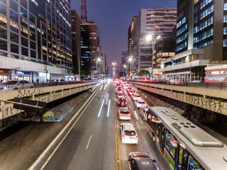 Fototapeta na wymiar Sao Paulo, Brazil September 01, 2022. Traffic of vehicles in Paulista Aveue at night in Sao Paulo city, Brazil