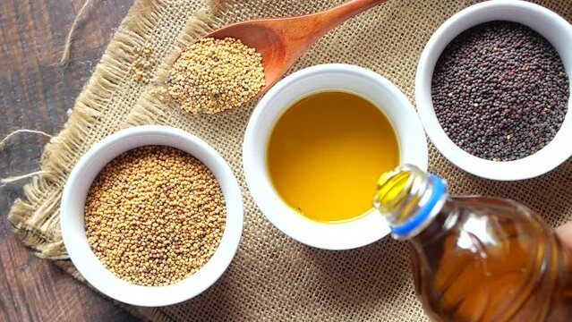 sunflower coking oil and seeds in a container on table 