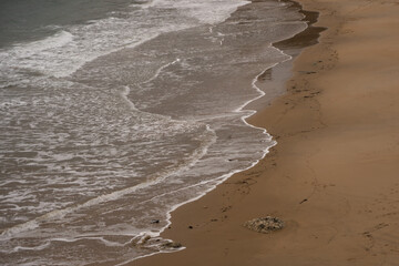 Ocean waves on sandy beach