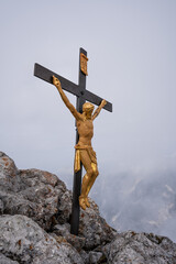 Closeup of the golden summit cross on top of Hocheck in the Alps