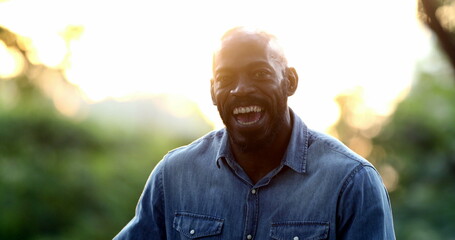 Happy black African man smiling, joyful person, charismatic friendly emotion