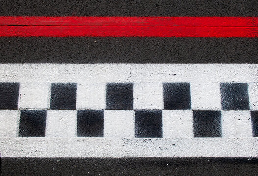 Asphalt background checkered sign, concepte of race competition finish