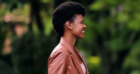 Confident African woman walking outside in street