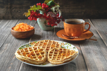 Waffles made from carrots with cloudberry jam.