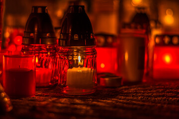 burning candles at night in the cemetery