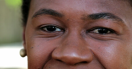 Obraz premium African woman macro close-up eyes looking at camera