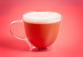 Latte in a Double Walled Tumbler on a Bright Background