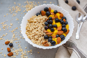 Bowl of oatmeal porridge with fresh fruits