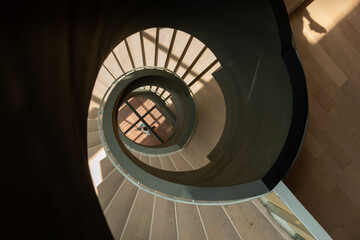 modern spiral staircase with black railing