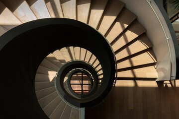 modern spiral staircase with black railing