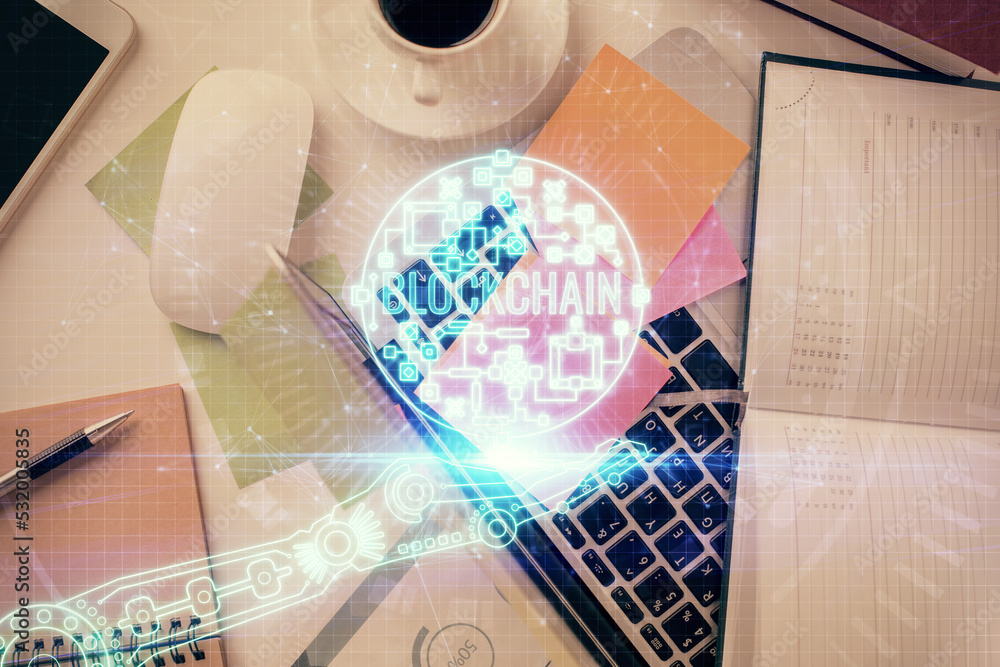 Aufkleber Blockchain theme hologram drawings over computer on the desktop background. Top view. Multi exposure. Concept of cryptoeconomy.