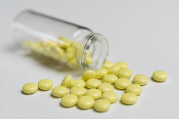 yellow tablets on a white table