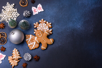 Christmas composition with gingerbread cookies, Christmas toys, pine cones and spices