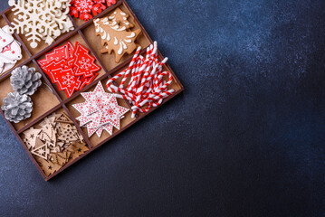 Christmas composition with gingerbread cookies, Christmas toys, pine cones and spices