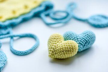 Beautiful baby knitted clothes and a toys for a newborn baby