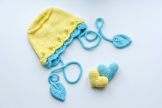 Beautiful baby knitted clothes and a toys for a newborn baby