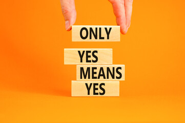 Only yes means yes symbol. Concept words Only yes means yes on wooden blocks on a beautiful orange table orange background. Businessman hand. Business, psychological only yes means yes concept.