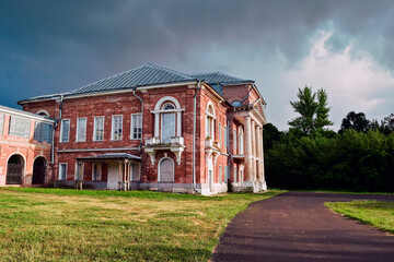 Photo of an old manor house on a summer evening before the rain
