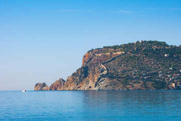Fototapeta na wymiar Fragment of the Alanya Peninsula with old city fortress, on a sunny day