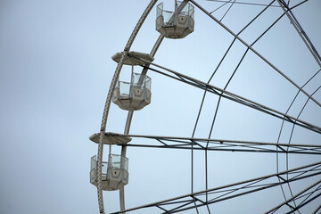 Ferris wheel cabins on the seafront.