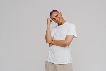 Young beautiful smiling boy with folded arms, propping his head