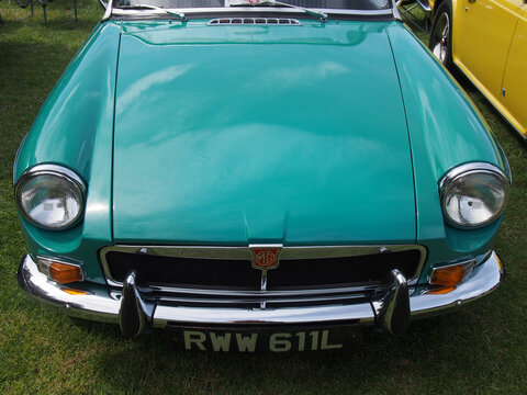 front view of a vintage green MGB 1960s british sports car at hebden bridge vintage weekend