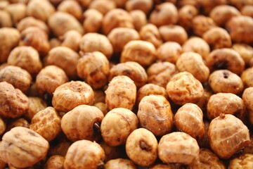 Close-up of chufa, tigernut, earth almond preparing for traditional typical tasty homemade cold fresh drink horchata from Valencia, Spain. Healthy organic food concept. Tiger nut for flour and milk