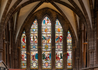 close-up view of a colorful stained glass window in the Chester Cathedral in Cheshire