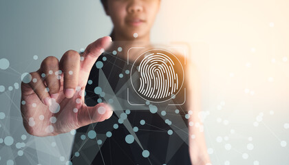 Asian businesswoman holding biometric fingerprint glassmorphism plate. Cyber security concept,...