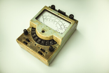 An old electrical device for measuring the current strength on a white isolate. Outdated...
