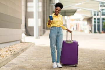 Happy African American Tourist Lady Showing Passport Standing At Airport