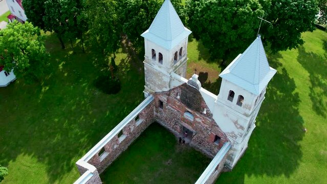 Bartninkai St. Apostles Peter and Paul Church ruins. Marijampole district, Lithuania. Aerial 4K footage