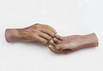 Hands of plastic mannequin  on white background.