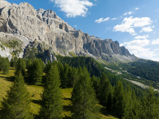 Fototapeta na wymiar Dolomites Italy mountain range holiday alps landscape clouds aerial cinematic. Mountain aerial drone view. Panorama overhead beautiful landscape.