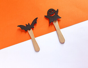 postcard with bat and ghost. holiday decoration concept