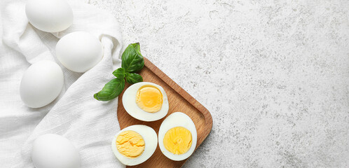 Many boiled chicken eggs on light background with space for text, top view