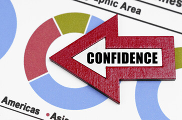 Against the background of the diagrams, an arrow with the inscription - Confidence
